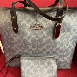 Coach tote 11x16x6 and small matching wristlet. Light blue with classic C design